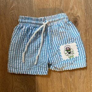 Blue Seersucker Stripe Boys Swimsuit with Smocked Buzz Patch